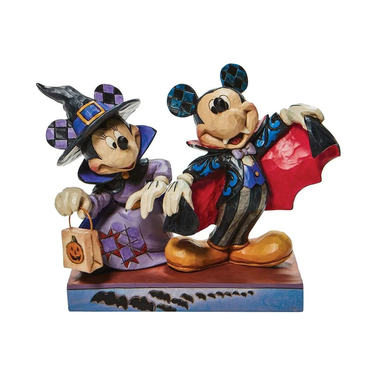 Figurine Mickey et Minnie déguisés pour Halloween 2025, sur fond automnal, symbole des vacances de la Toussaint pour les enfants.